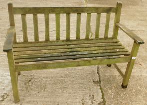 A wooden slatted garden bench.