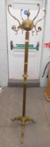 A late 20thC brass coat stand, with acorn finial top, on tripod base, 168cm high.