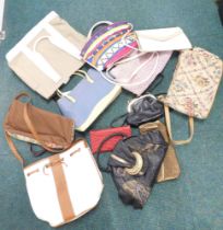 A group of lady's fashion handbags.