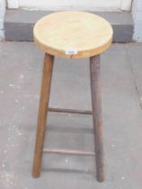 A stained pine stool.