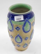 A Royal Doulton stoneware vase, with a geometric design in green and blue.