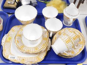 A Royal Stafford bone china orange Lattice pattern part tea service. (1 tray)