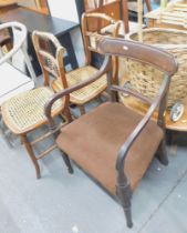 A carver chair and two rush seated walnut dining chairs.