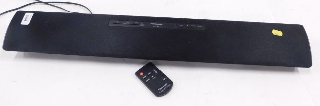 A Panasonic SC-HT88 sound bar and remote.
