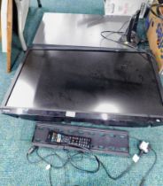 A Toshiba flat screen television, television aerial and sound box.