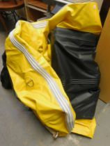 An inflatable dingy and kit bag with foot pump and oars.