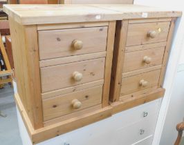 A pair of pine three drawer bedsides.