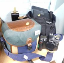 A United Colours of Benetton camera case, Nikon D70 camera, cobblers last, radio, and a Sony camcord