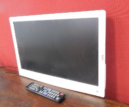 A Logic 32" flat screen television, in white with remote control.