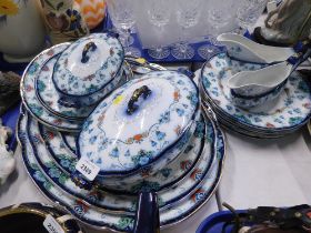 A Blenheim opaque china part dinner service, on a blue ground decorated with flowers in the Art Nouv