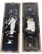 A pair of black lacquer painted and mother of pearl set panels.