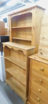 Two pine bookcases, 184cm high, 91cm wide, 30cm deep, and another 122cm high, 86cm wide, 23cm deep.