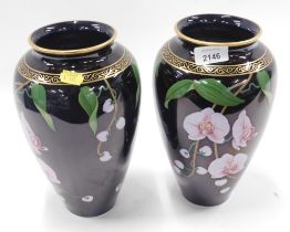 A pair of Franklin Mint Vase of the Fragrant Orchid by Miyagi orchid vases, each on a black ground.