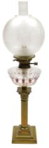 An early 20thC Hinks's Duplex glass oil lamp, of Corinthian column form, with a clear and red tinted