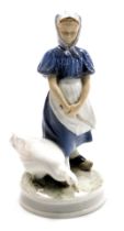 A Royal Copenhagen porcelain figure of a girl with a goose, no. 527, printed and painted marks, 24cm