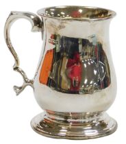 An Elizabeth II silver tankard, of baluster form, with a double loop handle, London 2010, 7.92oz.