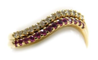 A diamond and ruby set double wave ring, in yellow metal, size Q, 2.4g.
