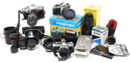 A Nikon camera, with 72mm sky lens, Praktica LTL3 camera, Olympus OM-2 camera, additional lenses, an