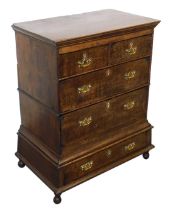 An 18thC oak chest on stand, the outswept pediment over two short above two long drawers, the base w