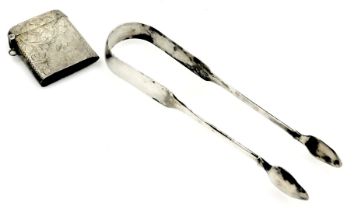 A pair of Georgian silver sugar tongs, and a Victorian silver vesta case, Birmingham 1900, 2.06oz.