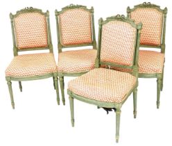 A set of four French Empire style single dining chairs, with a painted verdigris, with a bow carved