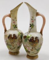 A pair of late 19thC Continental milk glass jugs, enamel decorated with birds and blossom, 32cm high