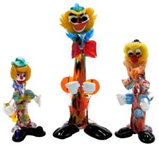 A Murano narrow glass figure of a standing clown, 36cm high, and two further clowns, one bent double