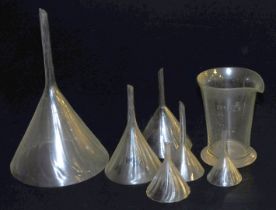 Five Victorian painted cut glass funnels, of spiral fluted form, largest funnel, 26 cm high, togethe