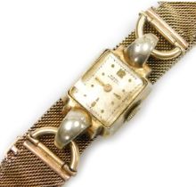 A mid century Bienna lady's gold plated cased wristwatch, rectangular white dial bearing an Arabic n