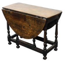 An 18thC and oak gateleg dining table, raised on turned legs united by a box stretcher, 72cm high, 9