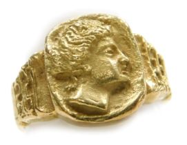 A Continental signet ring, embossed with a classical bust of a Greek lady, yellow metal, stamped 18K
