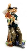 A Royal Doulton figure modelled as The Puppetmaker, HN2253.