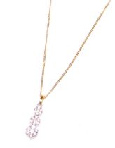 An 18ct yellow, white gold and diamond pendant, of three tiered graduated floral form, set with twen