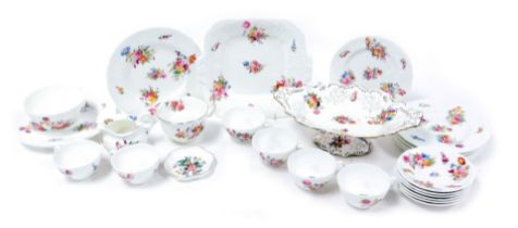 An early 20thC Coalport porcelain part tea service, moulded and decorated with floral sprays, compri