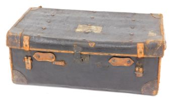 An early 20thC leather bound travel trunk, by JE Bennett of Sheffield, 77cm wide.