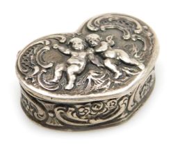 A Continental silver heart shaped pill box, embossed with cherubs and rococo scrolls, stamped 925, 1