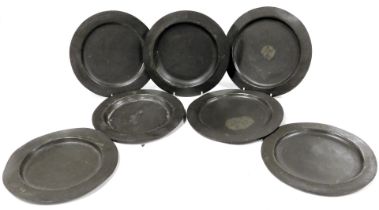 Seven Georgian pewter plates, most bearing initials EM, one with a coronet, traces of touch marks, 2