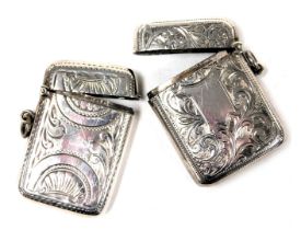 A Edward VII silver vesta case, with shell, floral and foliate engraving, Birmingham 1908, and a fur