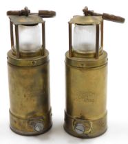 A pair of McGeoch brass miner's lamps, model no. 058 900 4090, 25cm high.
