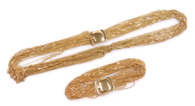 An Italian multi strand fringe necklace, on a snap clasp, stamped 750, and a matching bracelet, 73g.