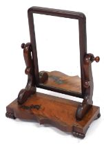 A Victorian mahogany swing frame toilet mirror, raised on a serpentine base, on cylindrical feet, 58