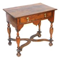 A William and Mary style oak side table, with one long frieze drawer, raised on turned legs united b