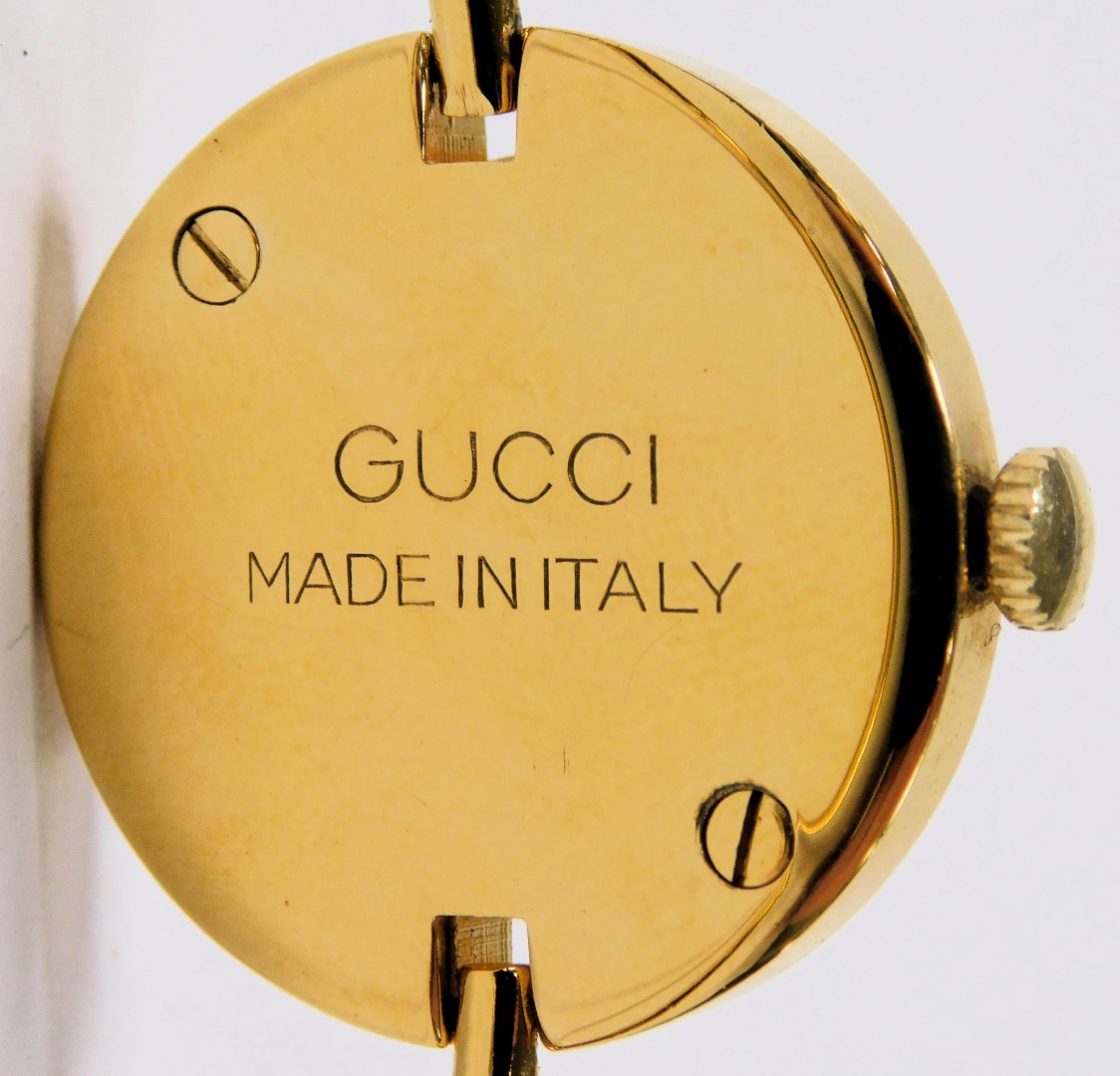 A Gucci gold plated lady's dress wristwatch, with twelve interchangeable coloured bezels, boxed. - Image 3 of 3