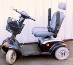 A Strider Days black mobility scooter, with battery and key.