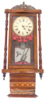 A late 19thC Anglo American walnut cased wall clock, circular dial bearing Roman numerals, eight day