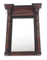 An early 19thC mahogany pier glass, with a break front pediment, above a rectangular glass plate fla