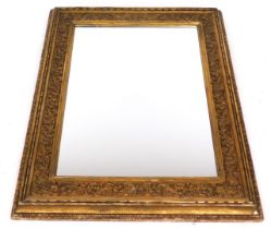 A Victorian gilt wood picture frame, converted to a wall mirror, with foliate moulding, 110cm x 89cm
