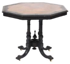 A Victorian ebonised and burr walnut centre table, the octagonal top carved to the edge with acanthu