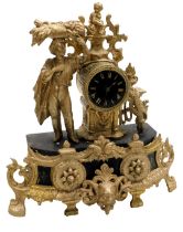 A late 19thC ebonised and gilt metal mantel clock, circular dial bearing Roman numerals, eight day m