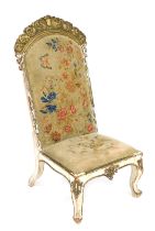 A 19thC Continental gilt wood prie dieu chair, floral and butterfly decorated overstuffed tapestry b